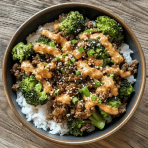This Teriyaki Ground Beef and Broccoli dish is a delightful and quick weeknight meal! Packed with flavor from the teriyaki sauce and complemented by the creamy Yum Yum sauce, it's sure to please the whole family. Perfect for busy evenings or a cozy dinner at home. Save this recipe for a delicious Asian-inspired feast that comes together in no time!