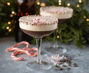 Delicious Peppermint Espresso Martini cocktail garnished with mint leaves and chocolate shavings.