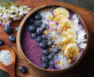 Healthy blueberry smoothie bowl topped with fresh berries and granola, colorful and appetizing.