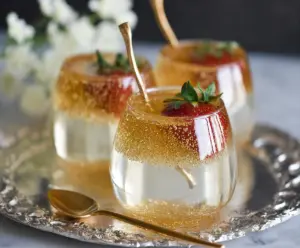 Delicious Champagne Jello Cups garnished with fresh fruit for a festive celebration