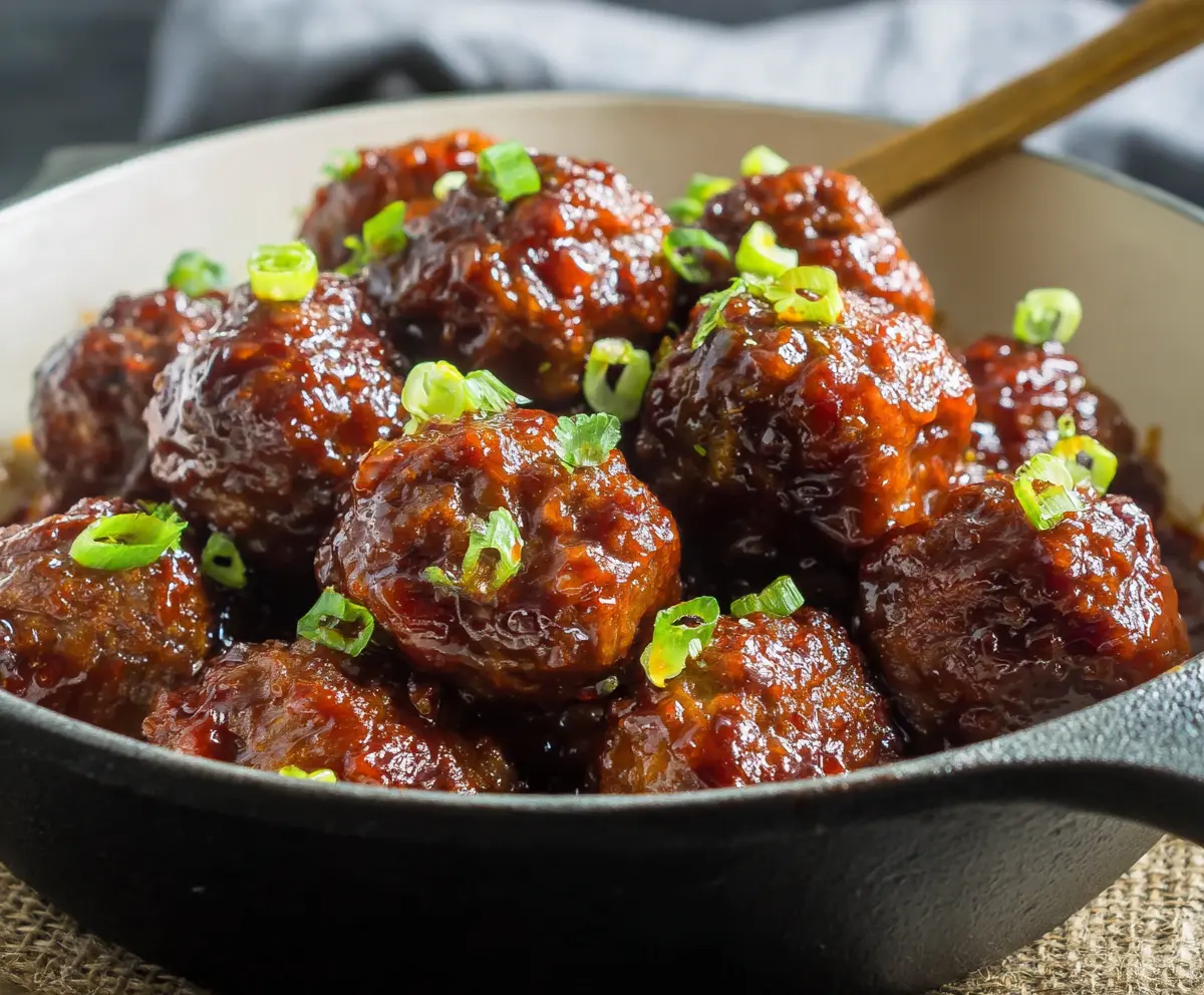 Delicious honey Sriracha meatballs served on a platter, showcasing a sweet and spicy glaze.