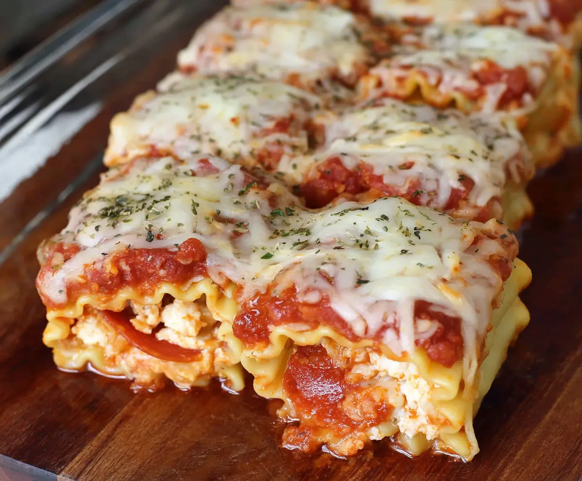 Delicious Pepperoni Pizza Lasagna Roll-Ups with melted cheese and savory pepperoni slices.