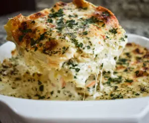 Delicious Chicken Alfredo Lasagna layered with creamy Alfredo sauce and tender chicken pieces.