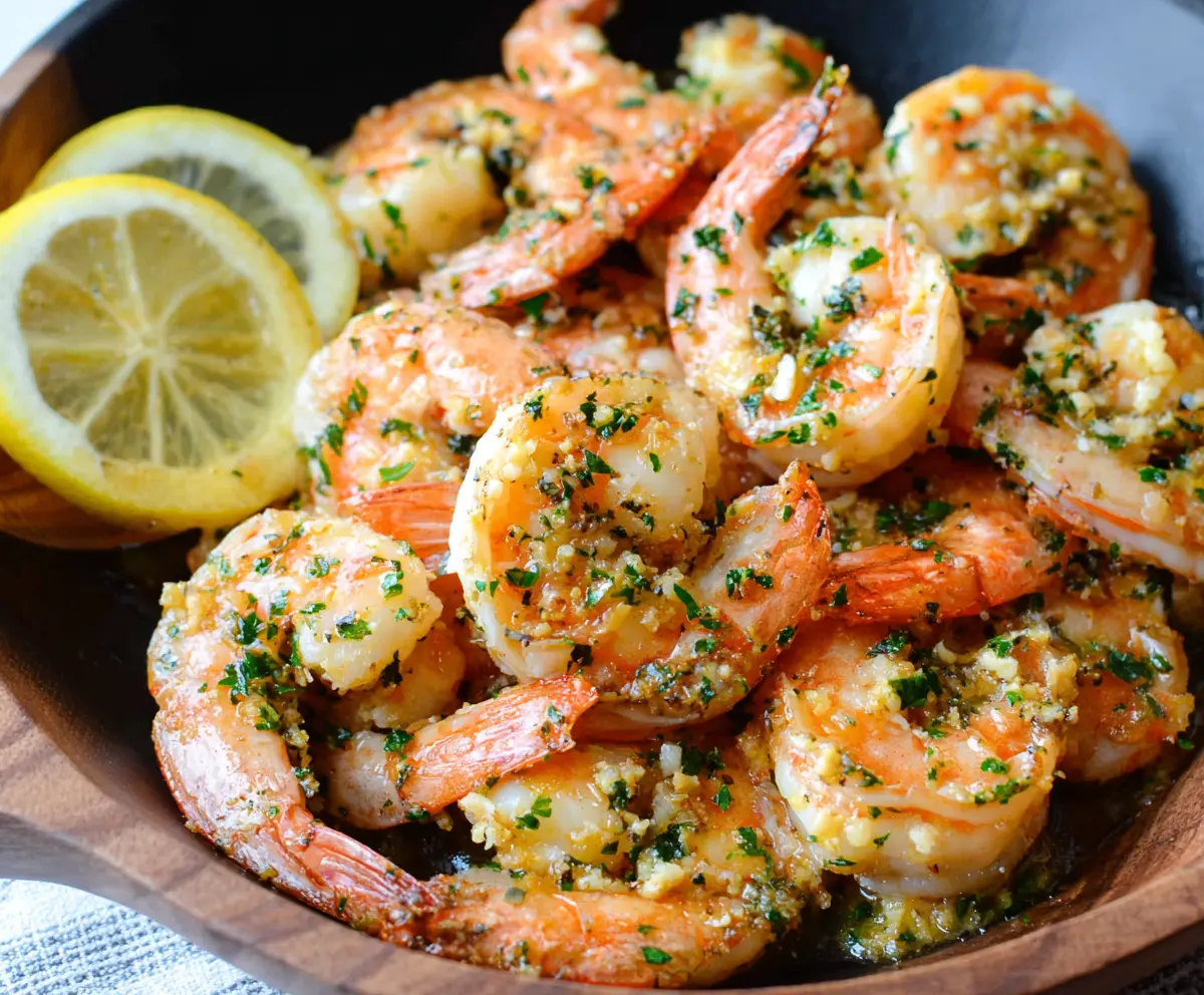 Delicious garlic butter lemon shrimp served on a plate with fresh herbs