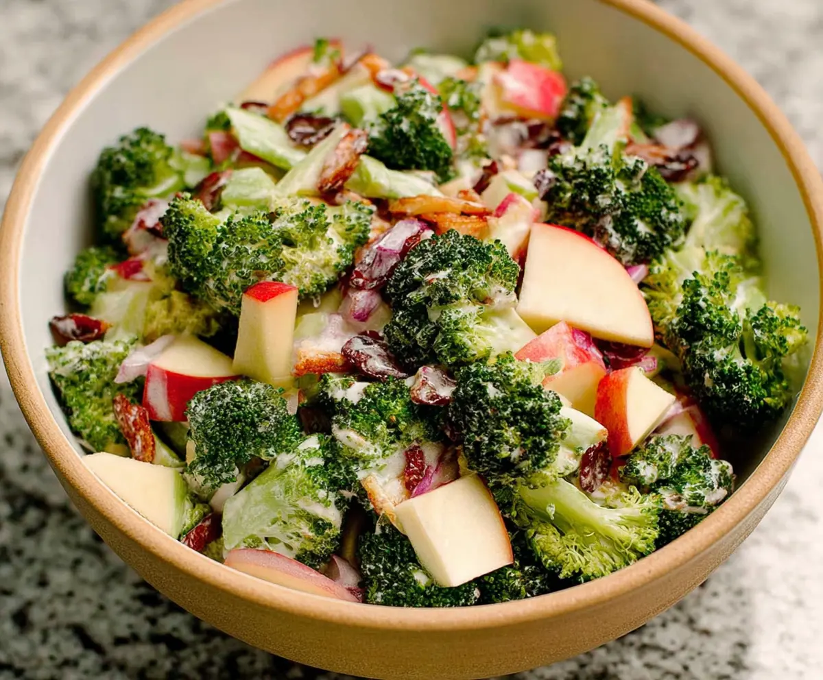 Fresh broccoli and crispy apple salad in a bowl, healthy and colorful side dish
