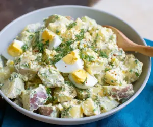 Colorful Easter Potato Salad with fresh vegetables and herbs in a festive setting